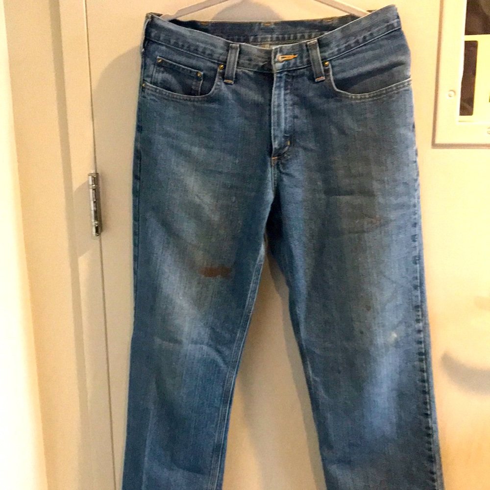 Carhartt jeans, worn but still have a lot of life left in them.  Stains/tears